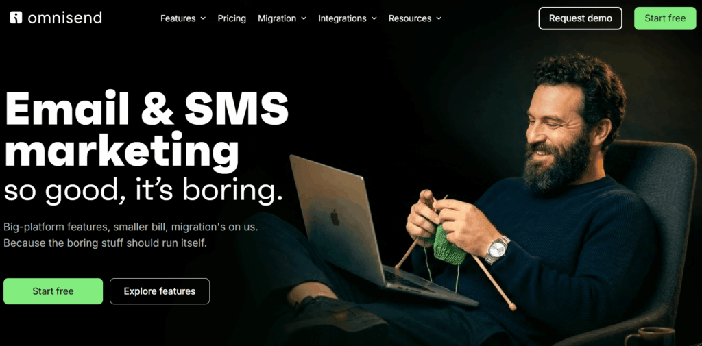 Best ecommerce personalization software: A bearded man sits on a couch knitting and smiling at his laptop. Large text reads, Email & SMS marketing so good, its boring. Omnisend branding and navigation buttons are visible at the top.