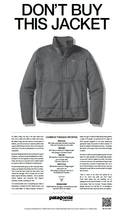 A gray Patagonia fleece jacket with text above reading Dont Buy This Jacket and informational text below.